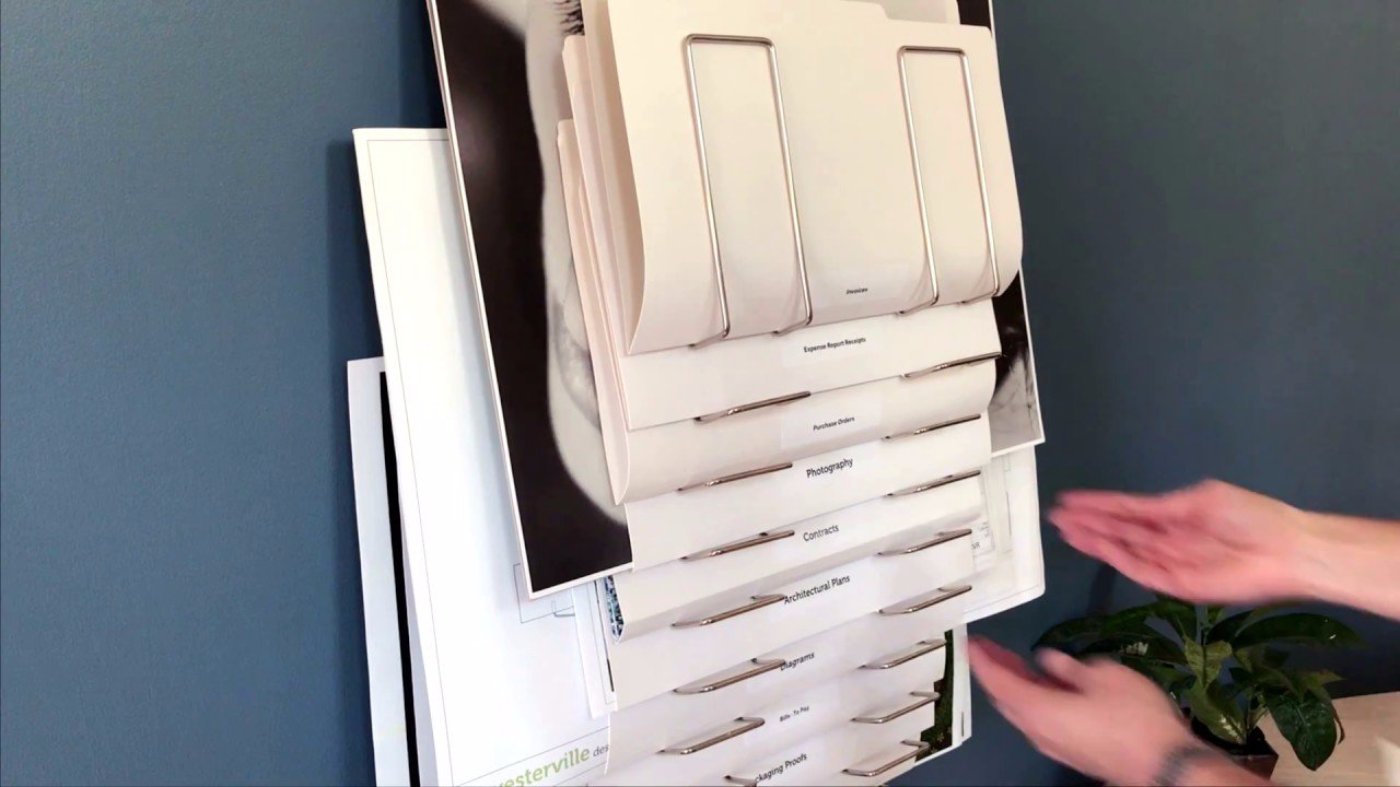wall mount file rack, the Up Filer. See how it works. Made of wood & nickel plated steel with 10 pockets or slots for organizing, papers, documents, files, drawings, plans, blueprints, art, prints, etc.